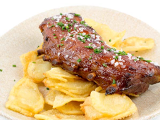 Costillar de cerdo al horno con barbacoa de naranja y miel de romero menú carta Catacaldos